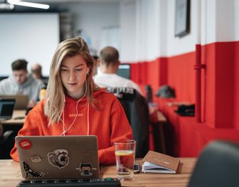 Woman with laptop studying Data Analytics Essentials